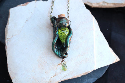 Nature inspired fantasy pendant with mystical green light and woodland details