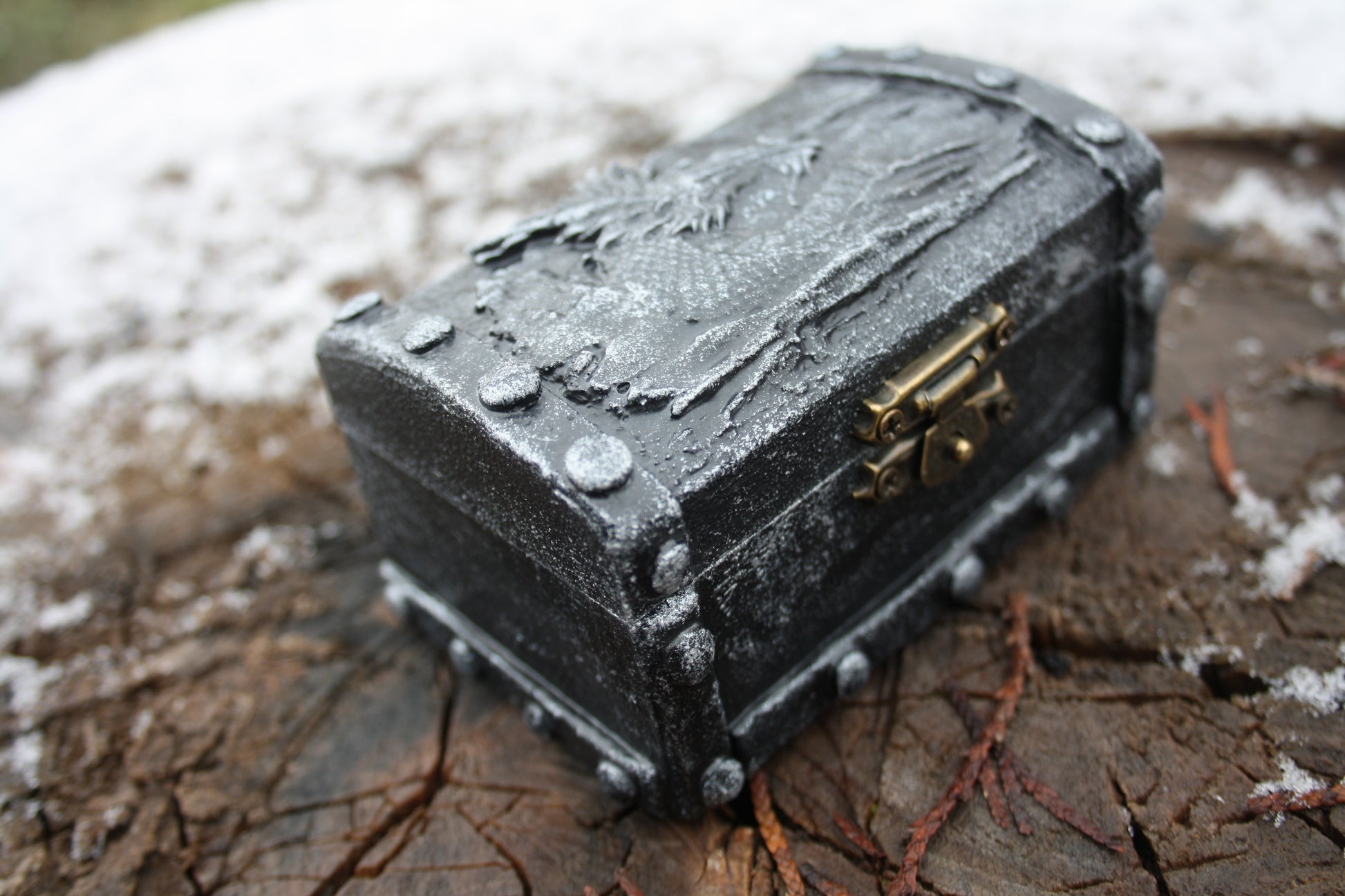 RPG dice box opened showing metal dice set inside