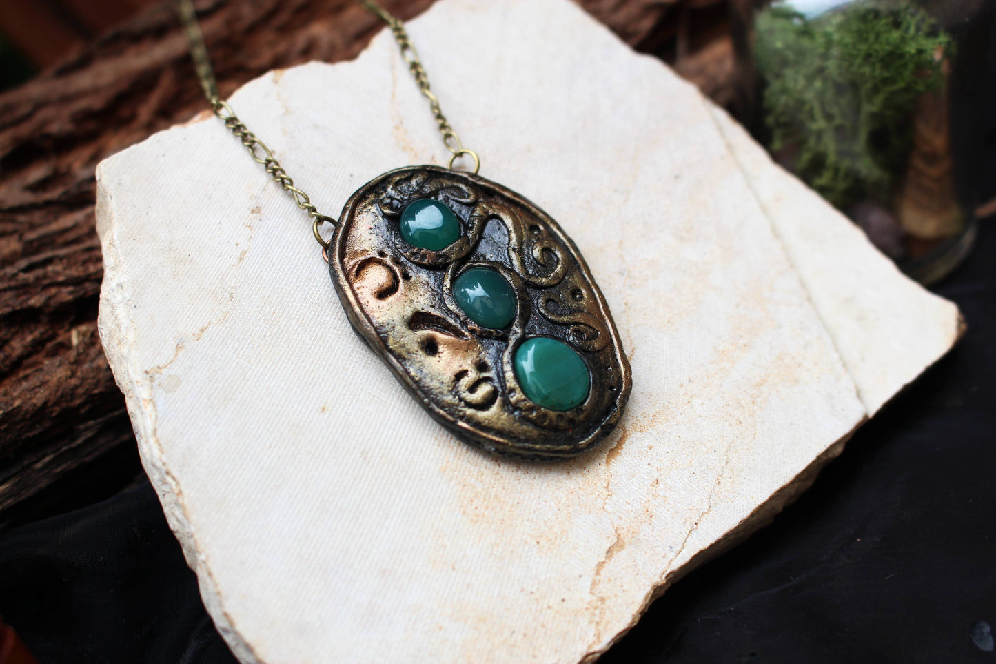 Detailed view of handcrafted fantasy jewelry with engraved rune symbols