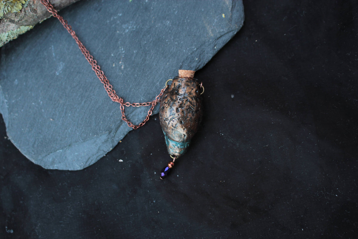 Rustic fantasy necklace with a nature-inspired pendant