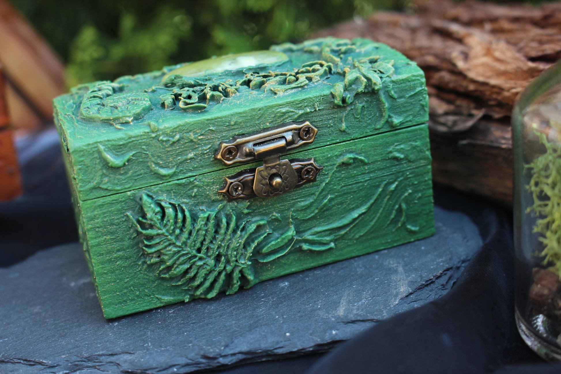 Small wooden chest with crystal and natural elements inside