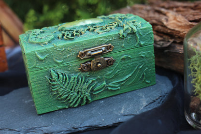 Small wooden chest with crystal and natural elements inside