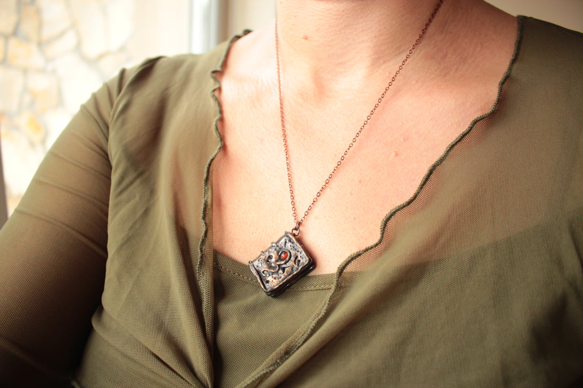 Handmade fantasy spellbook necklace with carnelian gemstone and metal chain