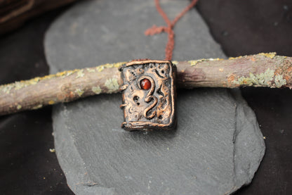 Handmade spellbook pendant necklace inspired by fantasy and RPG magic