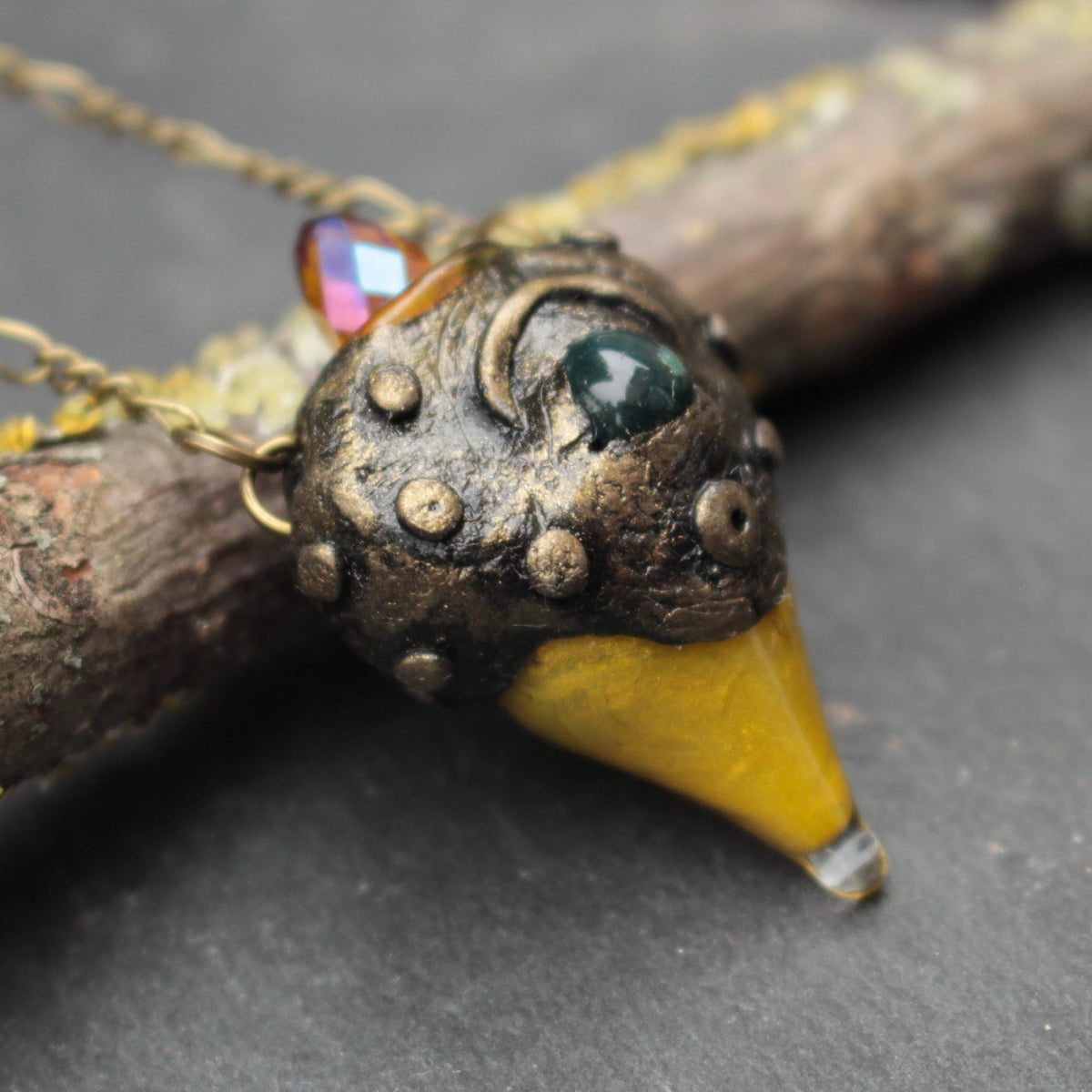 Handmade fantasy pendant necklace with green gemstone and bronze details