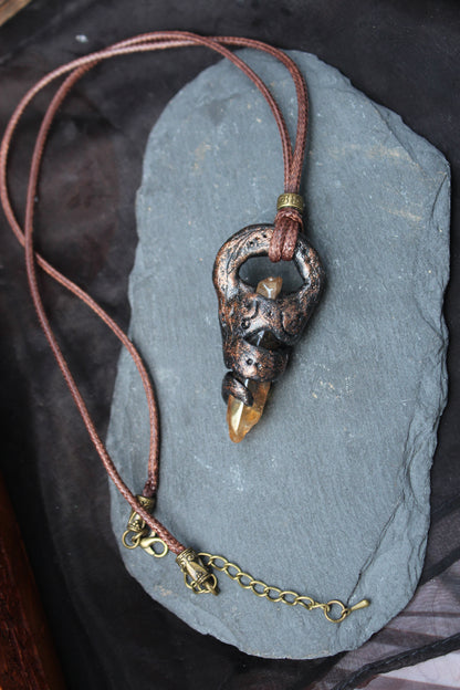 Handmade warrior necklace with a mystical talisman design and metallic finish