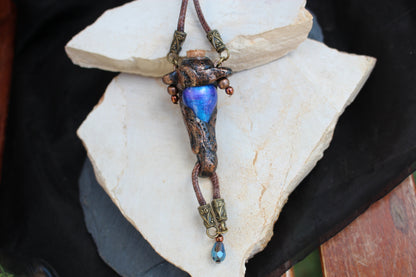 Witchy style potion necklace with mystical rune details and handmade finish