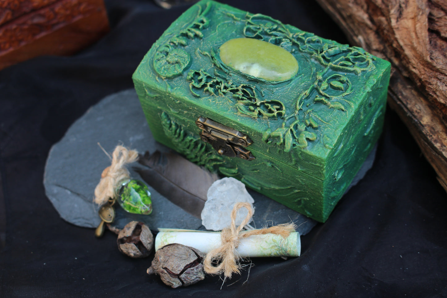 Wooden treasure box with moss potion and natural elements