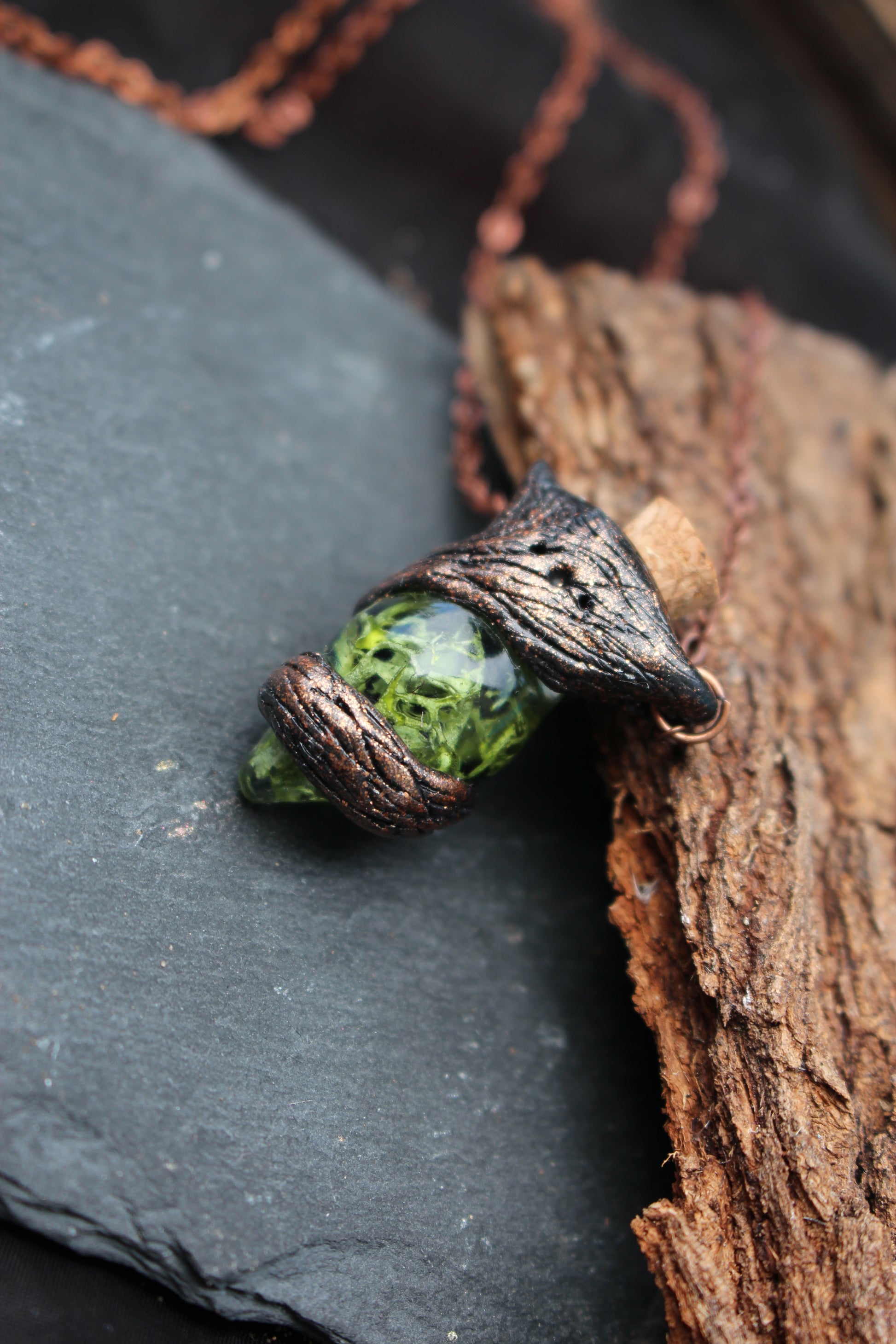 Fantasy pendant designed as an ancient woodland relic with natural moss