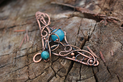 Close up of blue agate gemstone magical amulet pendant