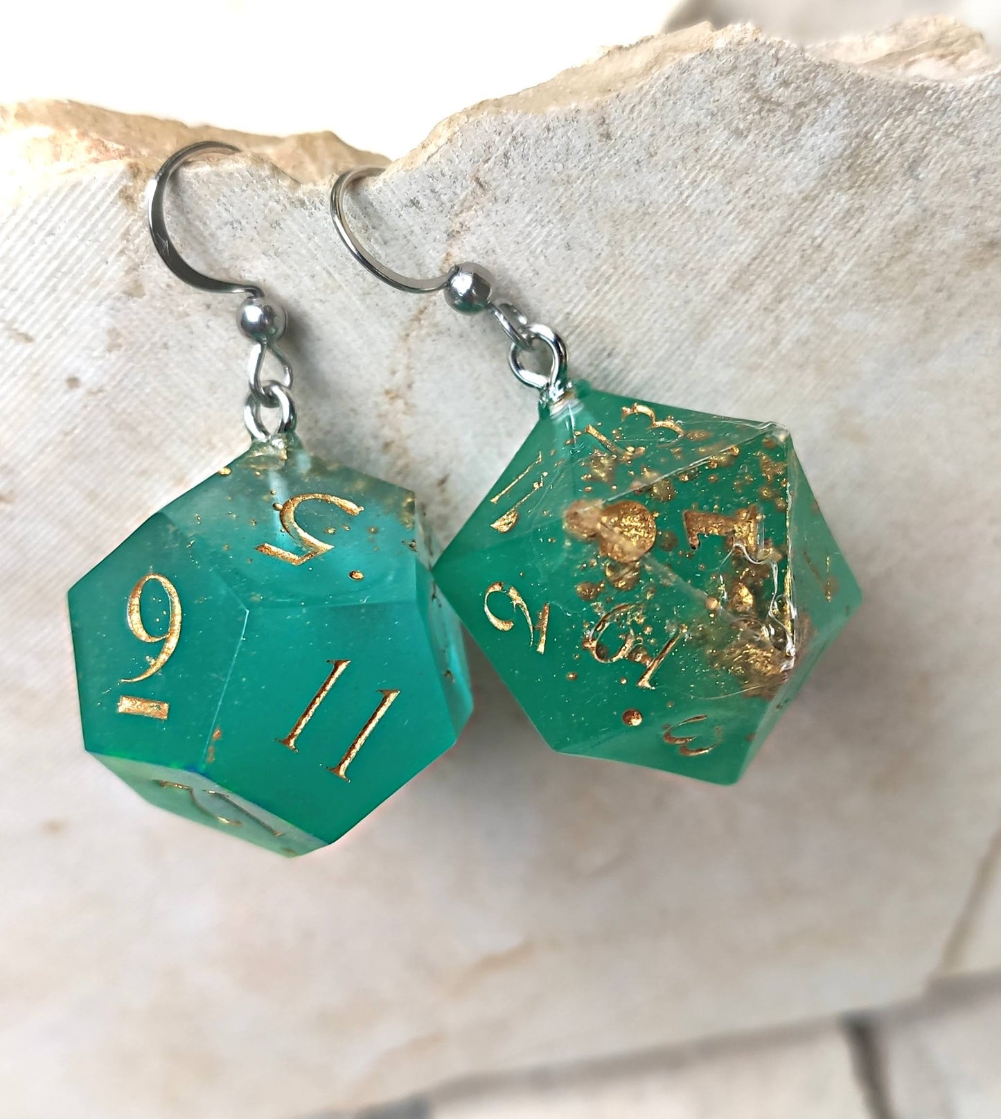 Glow-in-the-dark dice earrings for gamers and fantasy lovers