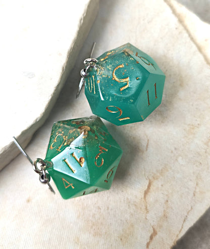 Glow-in-the-dark fantasy dice earrings inspired by RPG worlds