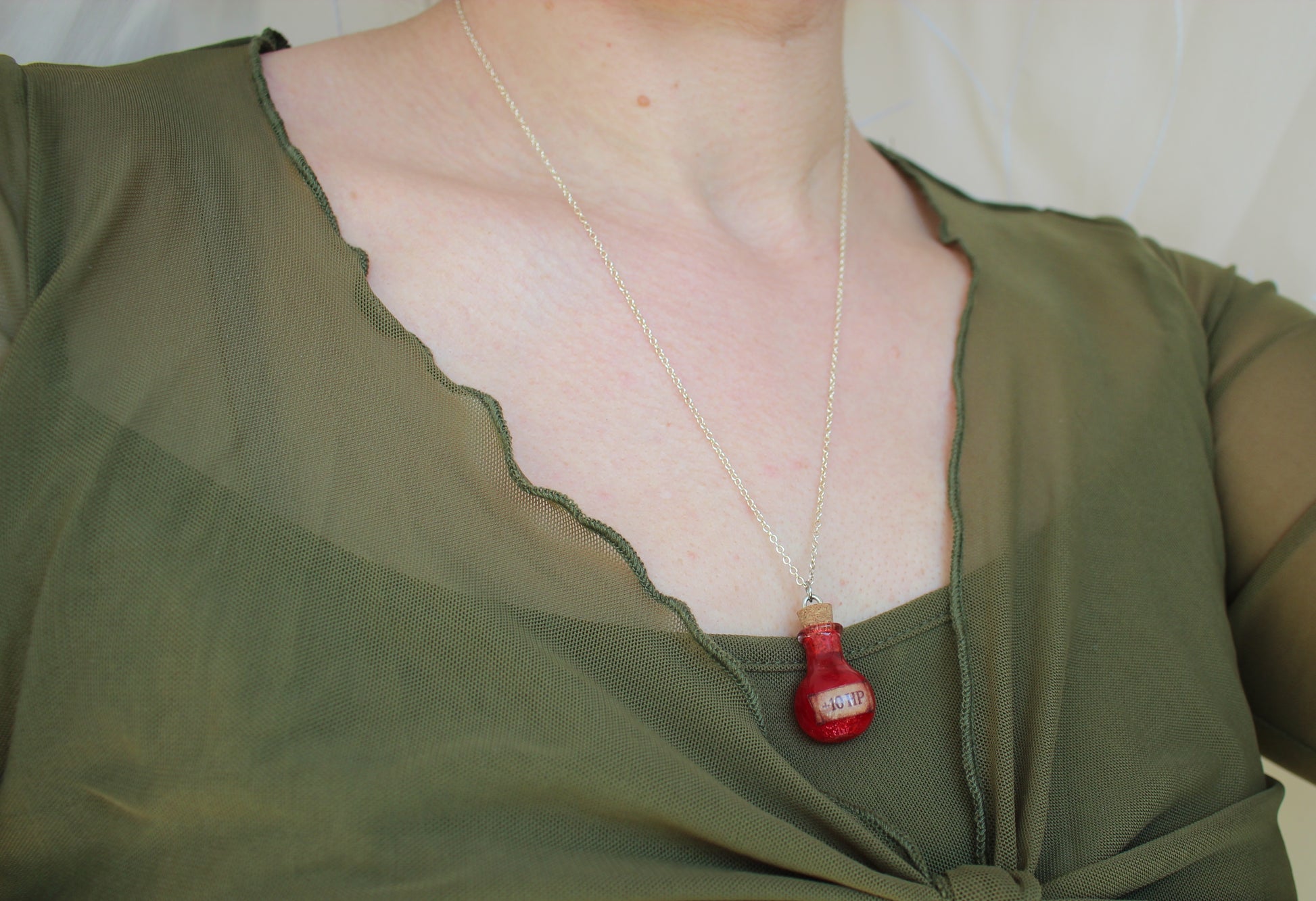 HP Healing Potion necklace worn, fantasy-inspired jewelry for RPG and D&D fan