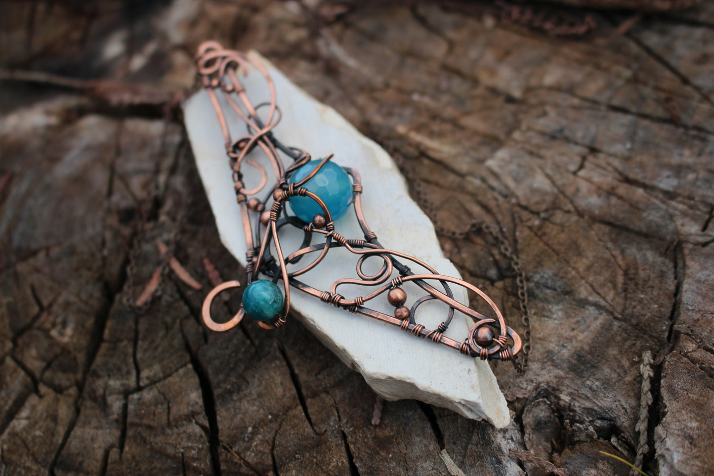 Handcrafted magical amulet necklace displayed on chain